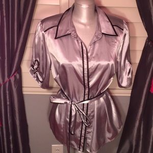 Satin gray top with black piping.